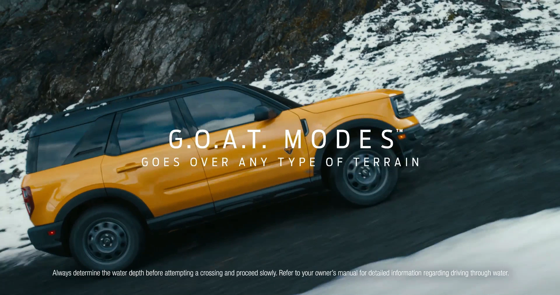 Original G.O.A.T. MODES / GOES OVER ANY TYPE OF TERRAIN lettering over the orange Bronco Sport.